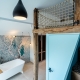 salle de bain baignoire chambre master bedroom suite parentale bleu mer architecte d'intérieur vaucluse haute-savoie genève avignon carpentras gordes coustellet apt luberon saint-julien-en-genevois vétraz industriel vieux bois réemploi poutres bleu blue sea hotel éco-responsable chêne local commercial meubles sur-mesure déco colorée conseil décorateur intérieur architecture d'intérieur mobilier suivi de chantier accompagnement travaux assistance à la maîtrise d'ouvrage éco-responsable